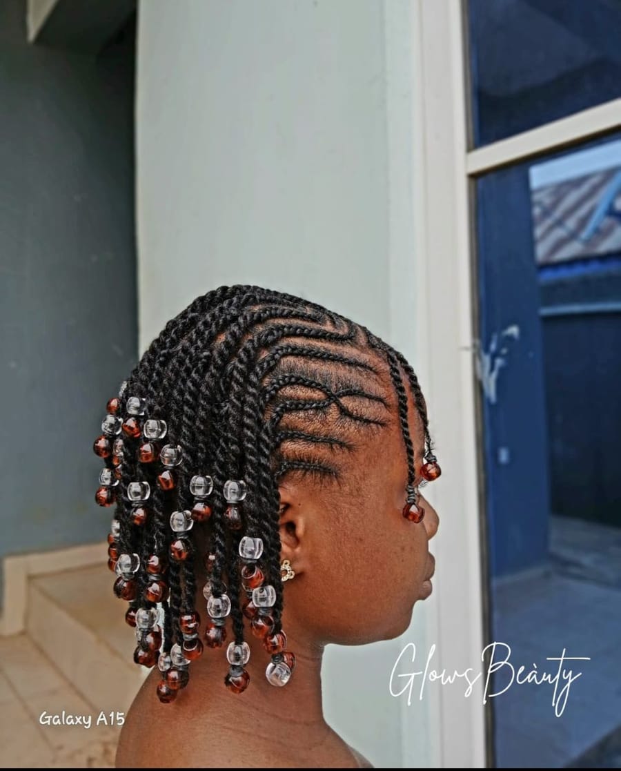 Children’s cornrows and twists finished with amber and clear beads